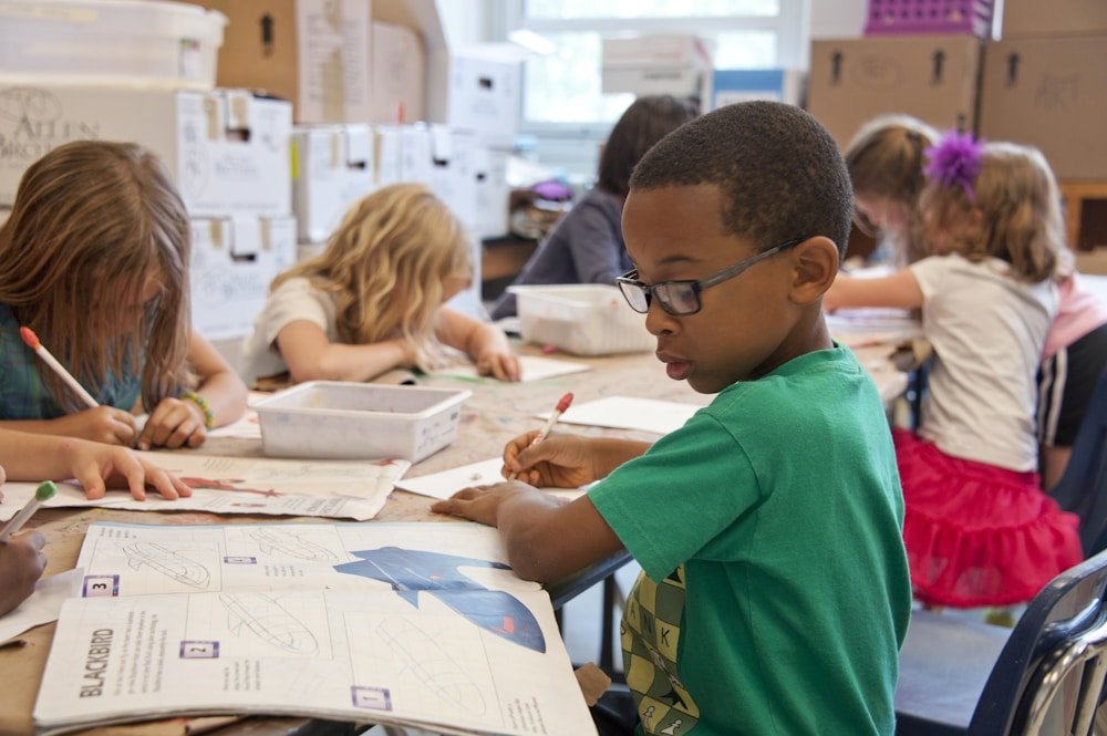 Children learning with a teacher